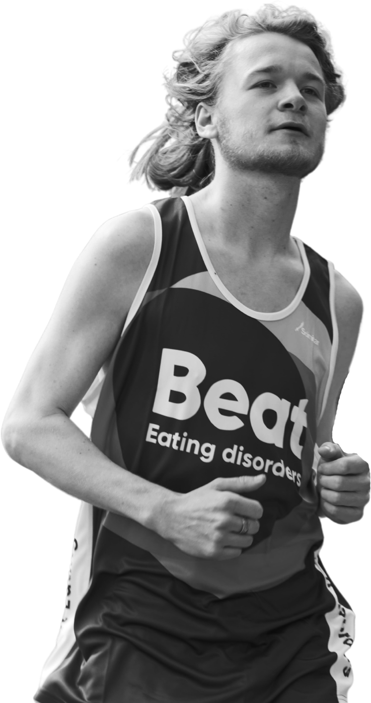 A young man running in Beat Eating Disorders running gear.